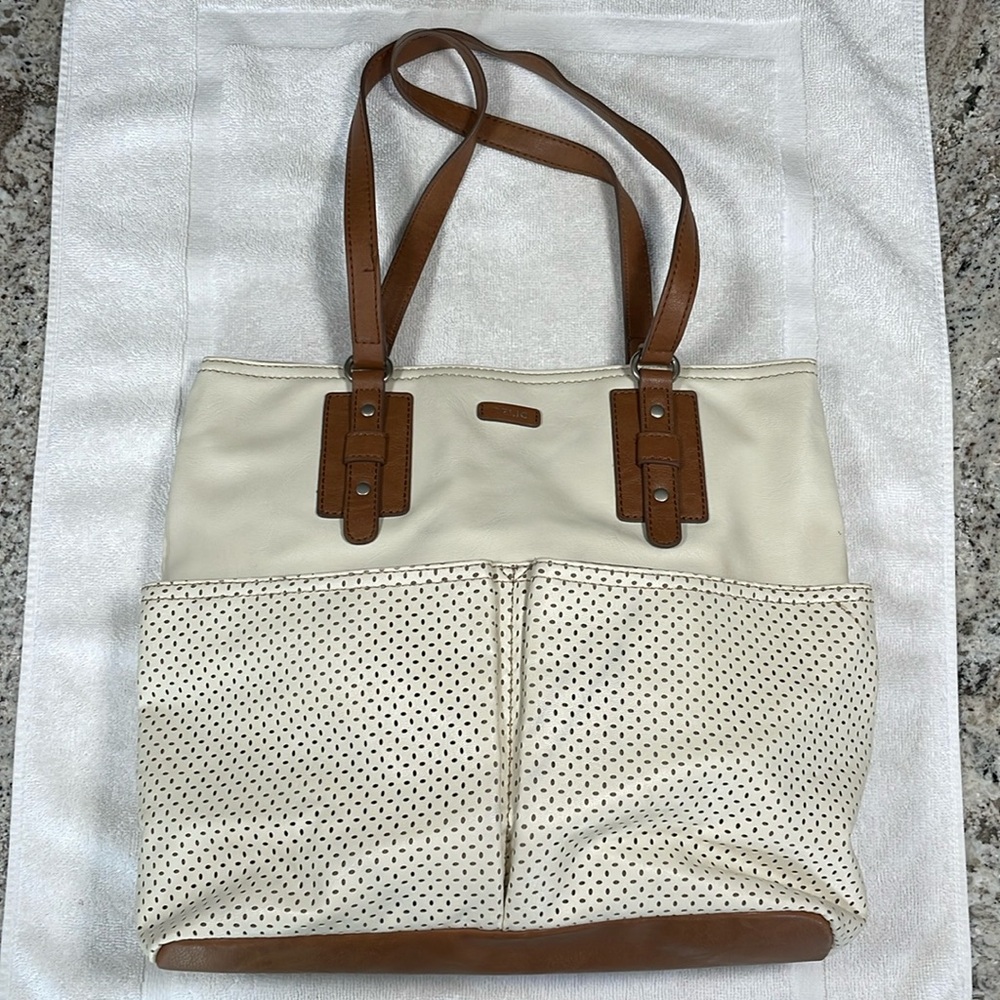 Like-new Relic purse in cream with brown accents.